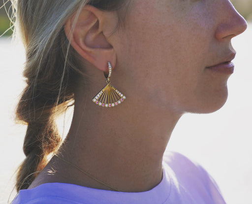 Pink spinel and diamond fan-shaped earrings worn. 