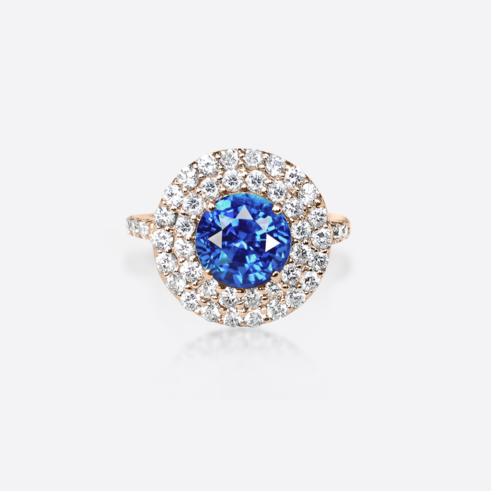 Bague de fiancaille femme or rose, diamants et saphir bleu.